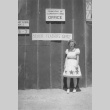 Evelyn Dell in front of the teacher's office (ddr-densho-152-25)
