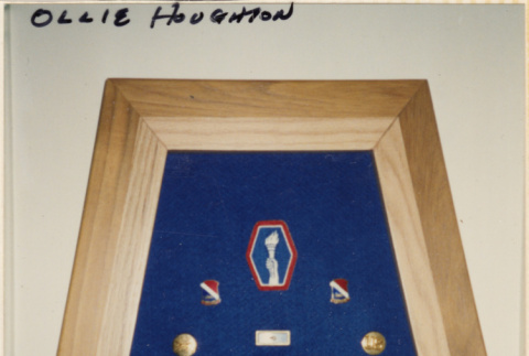 Frame with military insignia and pins (ddr-densho-466-319)