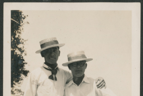 two men outside in straw hats (ddr-densho-378-644)