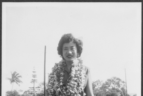 Nisei woman wearing leis (ddr-densho-363-88)