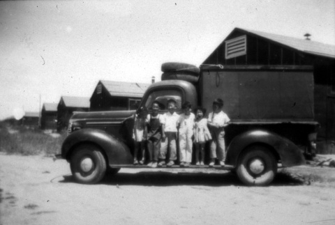Children standing on a truck (ddr-densho-34-146)