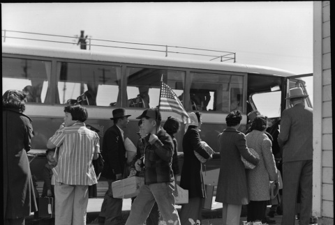 Japanese Americans boarding bus (ddr-densho-151-146)