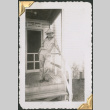Man standing at entrance to building (ddr-densho-434-373)