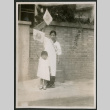 Woman and child waving flags (ddr-densho-359-932)
