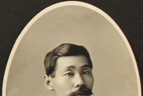Portrait of Nikkei man in a suit (ddr-densho-259-437)