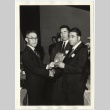 Man handing out award (ddr-jamsj-1-636)