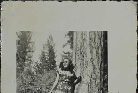 A woman standing against a tree (ddr-densho-321-1188)