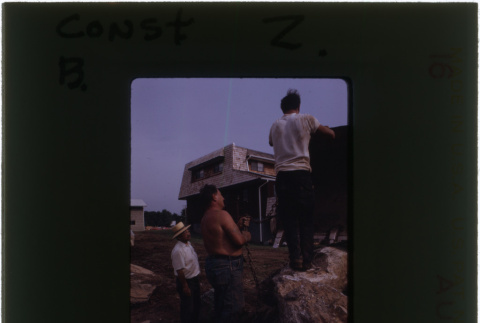Men working on rock garden construction (ddr-densho-377-916)
