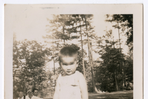 Toddler standing in grass at picnic (ddr-densho-483-655)