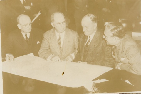 Carl Vinson and others reviewing a map (ddr-njpa-1-2317)