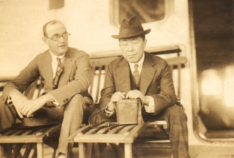 Two men seated on lounge chairs (ddr-njpa-4-17)