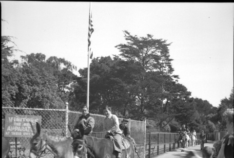 Two boys on pony ride (ddr-densho-426-963)