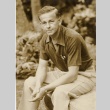 A man sitting, smoking a cigarette (ddr-njpa-1-795)