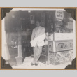 Gary Kikawa poses in a shop doorway (ddr-densho-542-61)