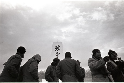 Pilgrims gathered in front of the Manzanar Cemetery Monument (ddr-manz-3-31)