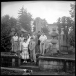 Group standing by stones in cemetery (ddr-densho-426-2470)