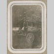 Ione McGee and man on a wagon (ddr-densho-383-99)