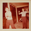 Two boys playing with toy gun (ddr-densho-522-514)