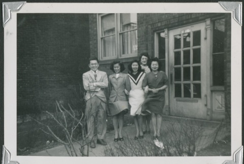 A group of friends in front of a building (ddr-densho-298-146)