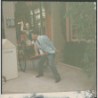 Man pulling woman in rickshaw (ddr-densho-523-464)