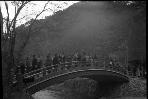 Group of people standing on small bridge (ddr-densho-426-291)