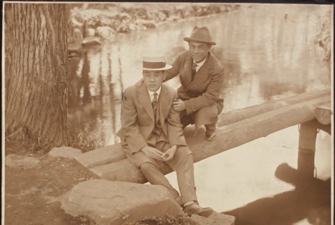 Two men posing near a river (ddr-densho-278-45)