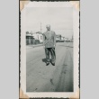 Man in doublebreated suit poses in street (ddr-densho-321-255)