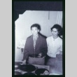 Young man and woman looking at vinyl records (ddr-densho-330-153)