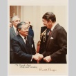 Signed photograph of Frank Sato with former president Ronald Reagan (ddr-densho-345-27)