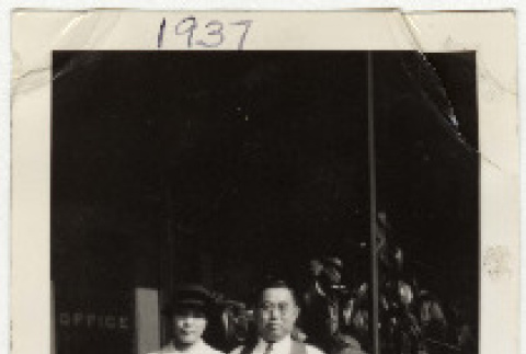 Suejiro and Masa Kosai standing front of The Grand Hotel (ddr-densho-349-1)