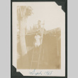 boy and girl sitting on ladder (ddr-densho-378-671)