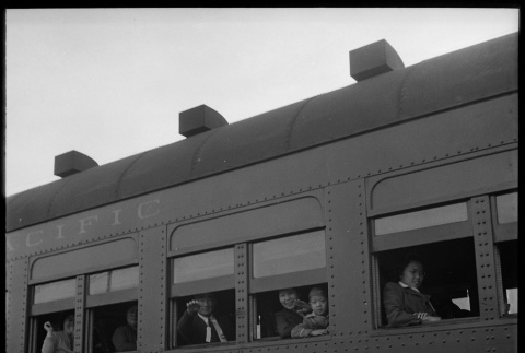 Japanese Americans waving goodbye from train (ddr-densho-151-299)