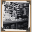 Man behind a cash register (ddr-densho-542-96)