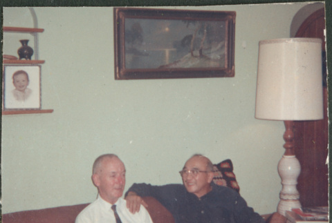 Chester Sakura Sr and man sitting on sofa (ddr-densho-523-460)