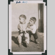 Two young boys playing, one on tricycle (ddr-densho-483-662)