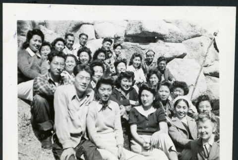Photograph of a group of people, including Bernice Sibner, sitting on rocks in the Sierra Nevada (ddr-csujad-47-298)