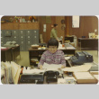 Woman seated in office (ddr-densho-426-141)