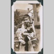 Photo of Kenji Ima holding dog (ddr-densho-483-1224)