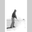 Japanese American man golfing (ddr-densho-157-10)