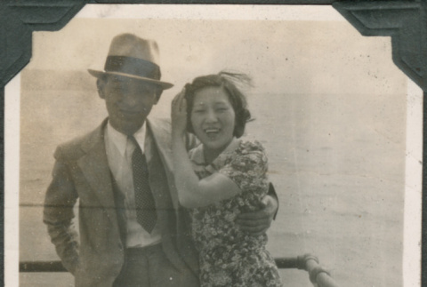 Couple standing by railing overlooking water (ddr-densho-316-341)
