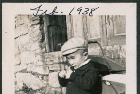 Photo of a child next to a pram (ddr-densho-483-714)