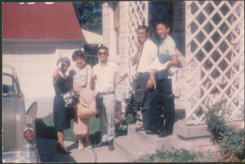 Agnes Sakura with woman and three Sakura brothers standing on steps (ddr-densho-523-353)