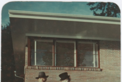 Man and woman standing in front of building (ddr-densho-332-4)