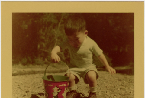 Young Boy with bucket (ddr-densho-426-180)