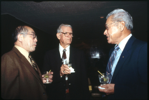 Shig Kihara, John Burden, and one other with cocktails (ddr-densho-1007-737)