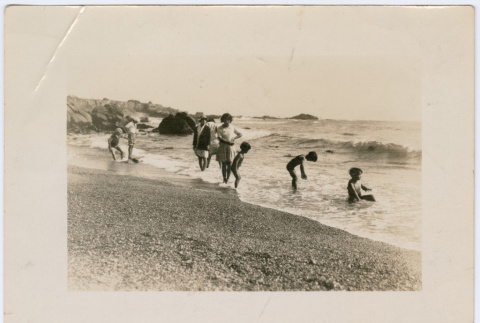 Group playing at the shore (ddr-densho-433-602)