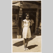 Photo of girl in front of store (ddr-densho-383-510)