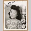 Portrait of a young woman with flowers (ddr-densho-542-252)