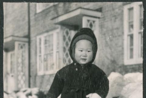 Toddler in snowsuit in snow (ddr-densho-523-192)