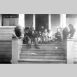 Children sitting behind a store (ddr-densho-25-102)